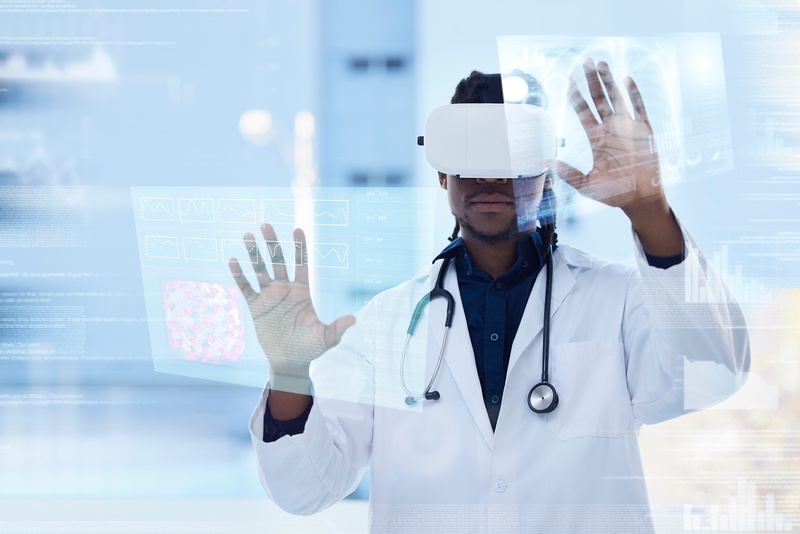 black medical doctor interacting with x-ray scans on screen